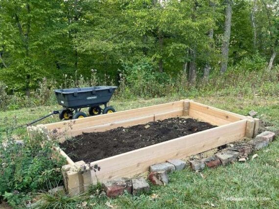 simple raised garden bed made with concrete planter corner blocks