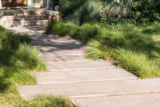 concrete pavers and native grasses being used as alternative to grass