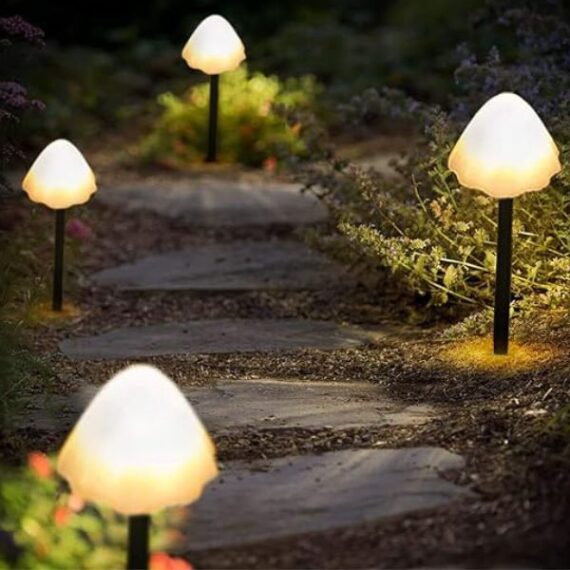 mushroom lights with glowing caps along garden path